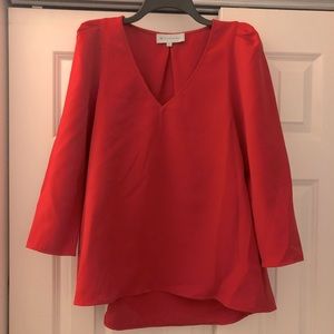 Tuckernuck red top with slight puff sleeve